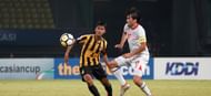 Tajikistan goalscorer Ehson Panshanbe in action against Zahril Zabri of Malaysia (Image Courtesy: AFC)